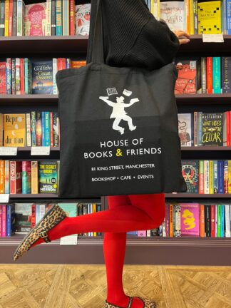 A black House of Books & Friends tote bag, with the bookshop's logo and address printed on it.